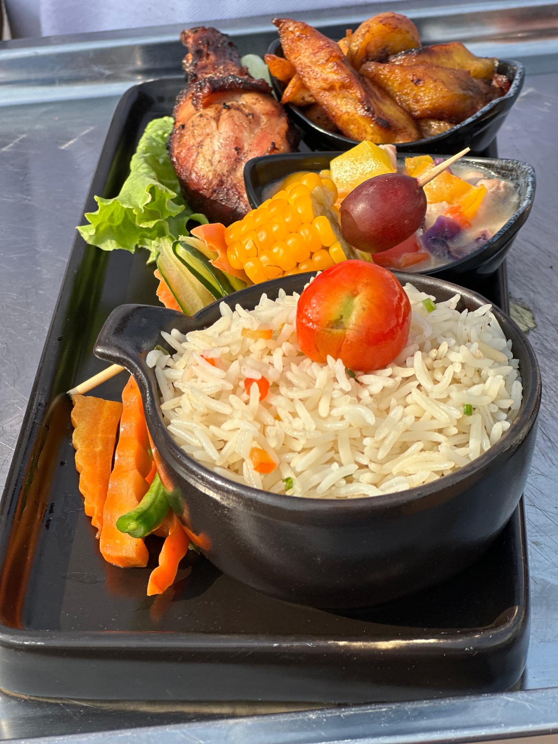 Signature Basmati Fried Rice, Turkey Sauce, Corn Hub, Grilled Chicken and Peppered Hake Fish